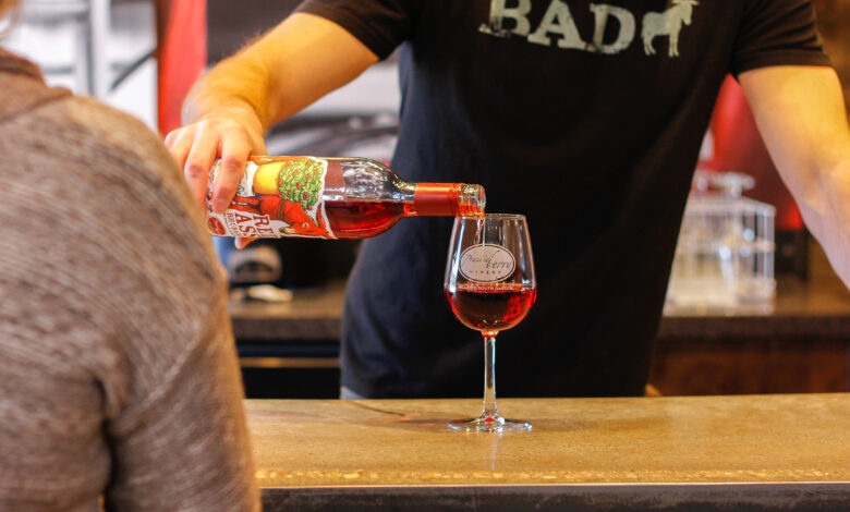 Picture of a Workamper pouring wine at Prairie Berry Winery