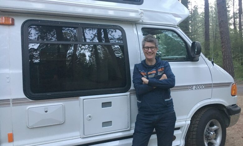 Image of Kathy Belge next to her RV, Squeaky.