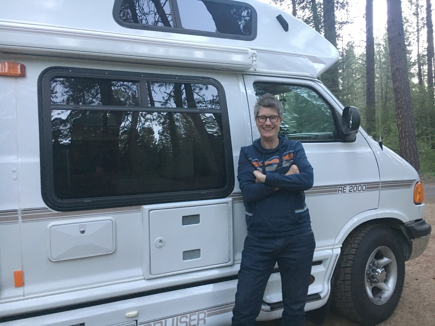 Image of Kathy Belge next to her RV, Squeaky.