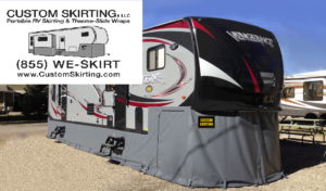 Photo of an RV with custom skirting beneath it. 