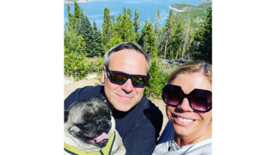 Photo of Michael Anderson, Andrea Argy and their pet pug, Bruce Lee.