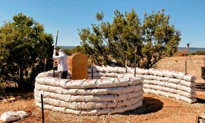 Photo of some building an earth structure at Las Caranaras Canyon Ranch.