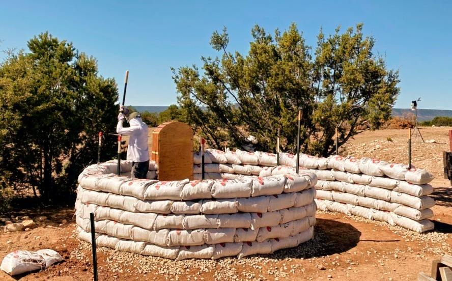 Photo of some building an earth structure at Las Caranaras Canyon Ranch.