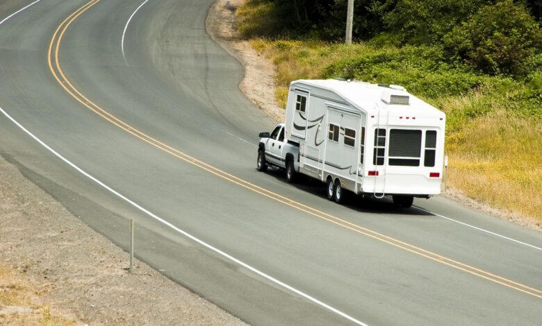 Photo of a fifth wheel RV on the road
