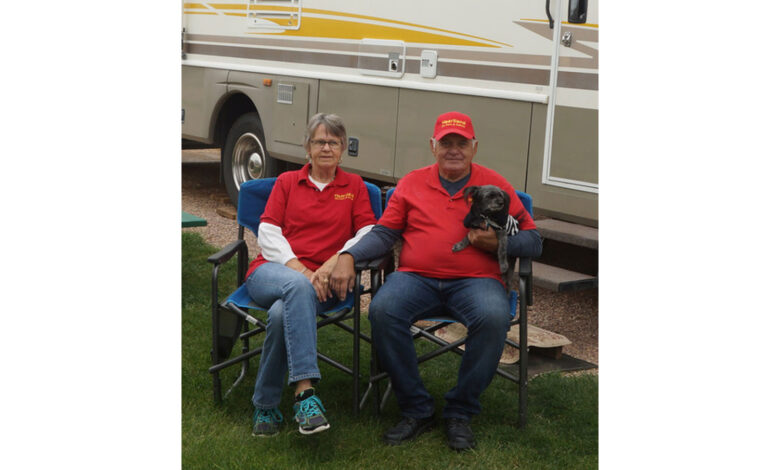 Photo of Jack and Linda Vido with their dog, Weezer.