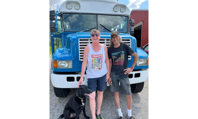 Mandy and Allen Hallengren in front of their converted school bus.