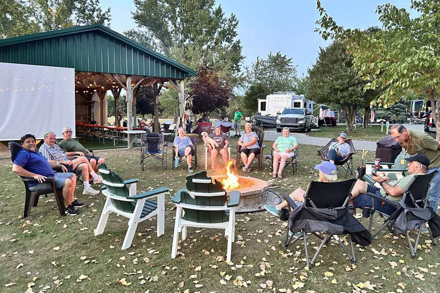 Guest gather for a campfire and movie night at Holiday RV Park in Traverse City, Mich.