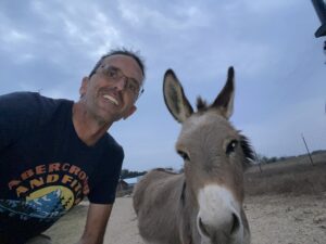Jimmy Bartleman and a donkey, George, he met at a Hipcamp farm.